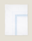 Tre Righe flat sheet white/light blue folded.
