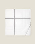 white quiltino with charcoal embroidery