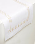 white linen table runner with beige stripes embroidery