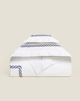 Treccia Moderno white/navy duvet cover folded.