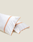 Treccia white/orange pillowcase pair