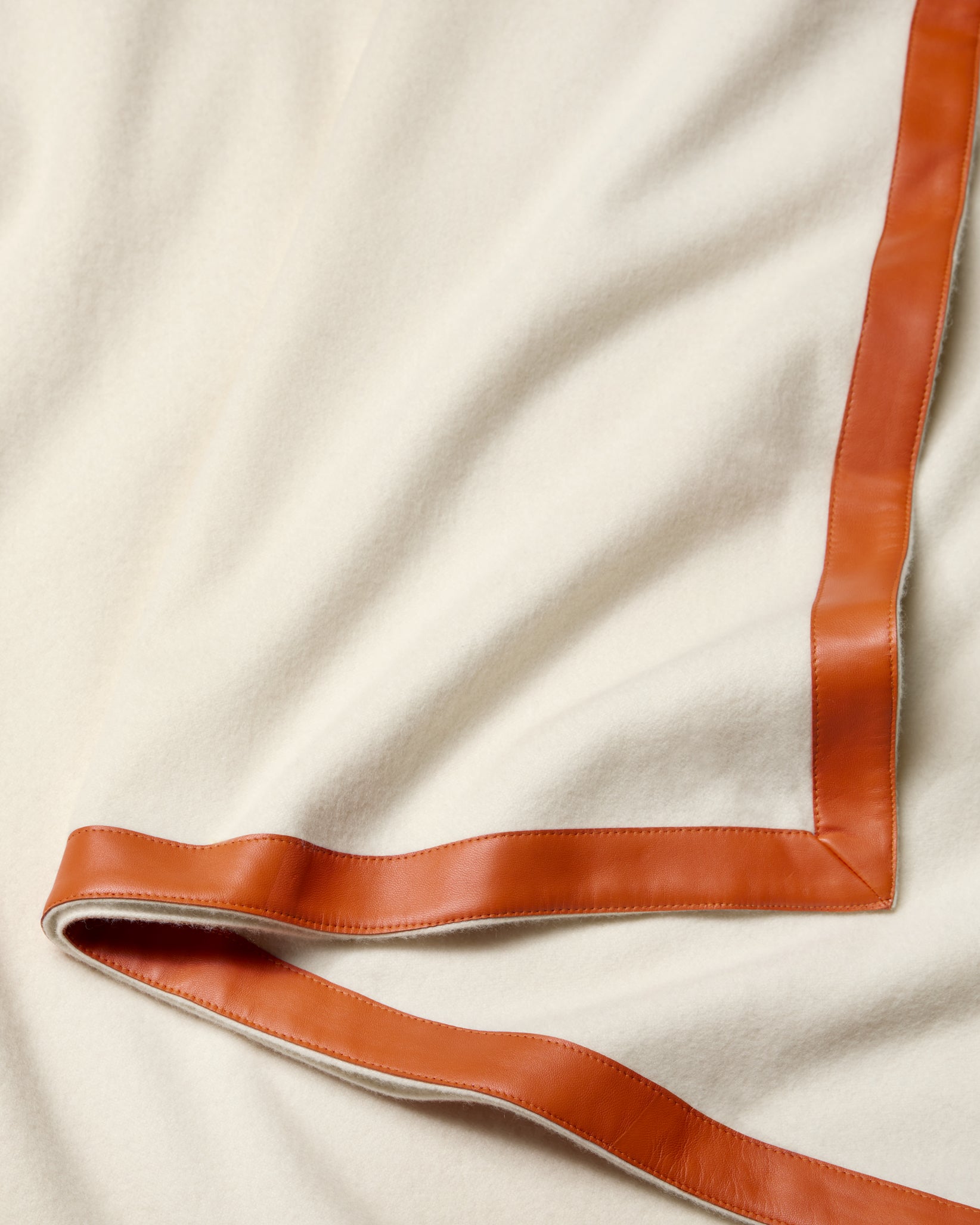 Ivory/orange dolomiti throw texture