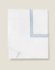 Tre Righe Splendore duvet cover folded in white/medium blue