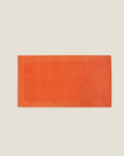 Treccia beach towel in orange