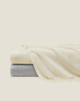 Misurina throws stacked in ivory and grey