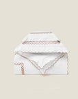 Treccia Splendore duvet cover stack in white/rose gold