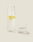 Onda chiara carafe and cup filled with lemon water