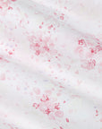 White fabric with pink floral patterns