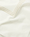 Tre Righe Ivory/beige bed linens close up