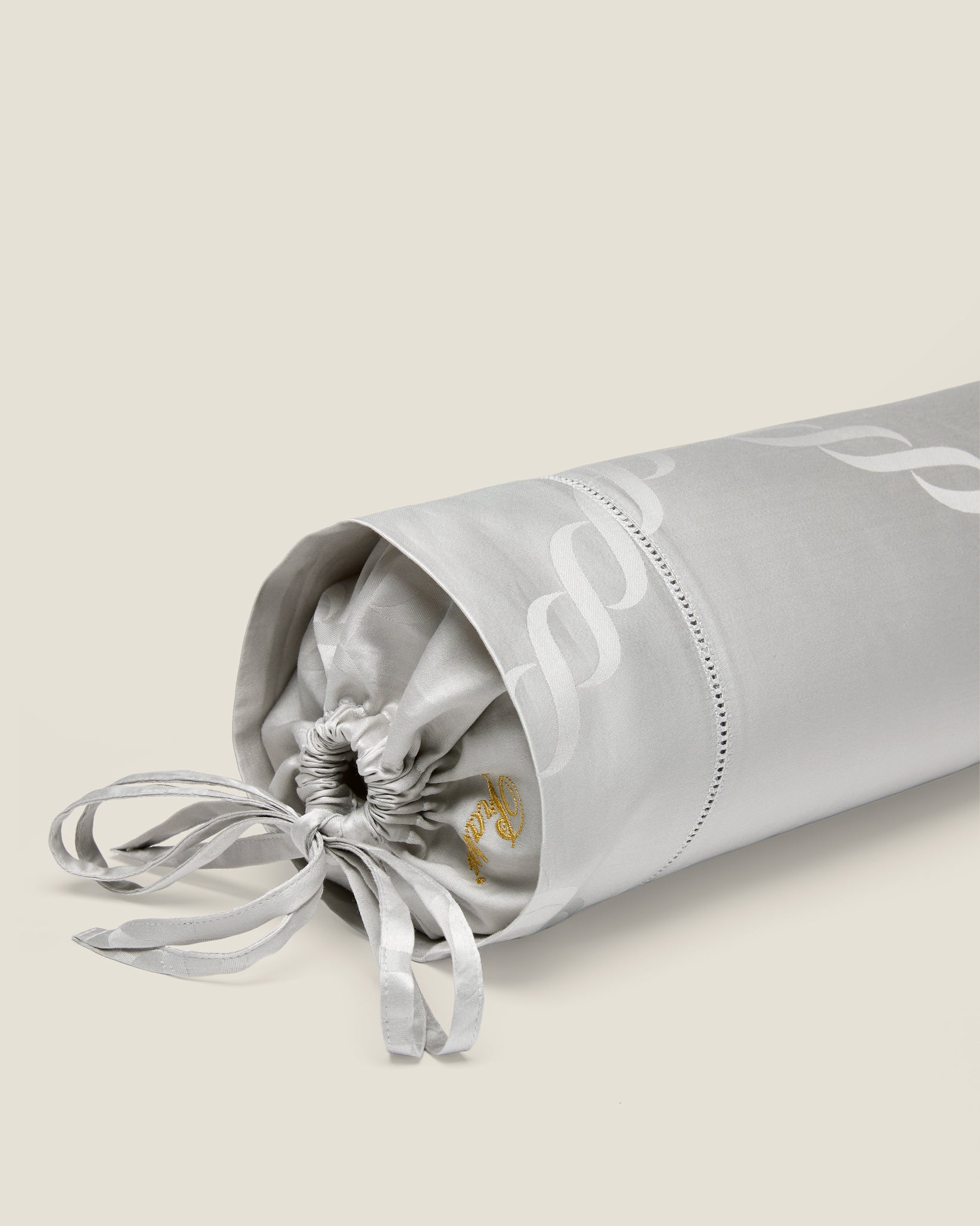 Ori Treccia neckroll sham in sterling