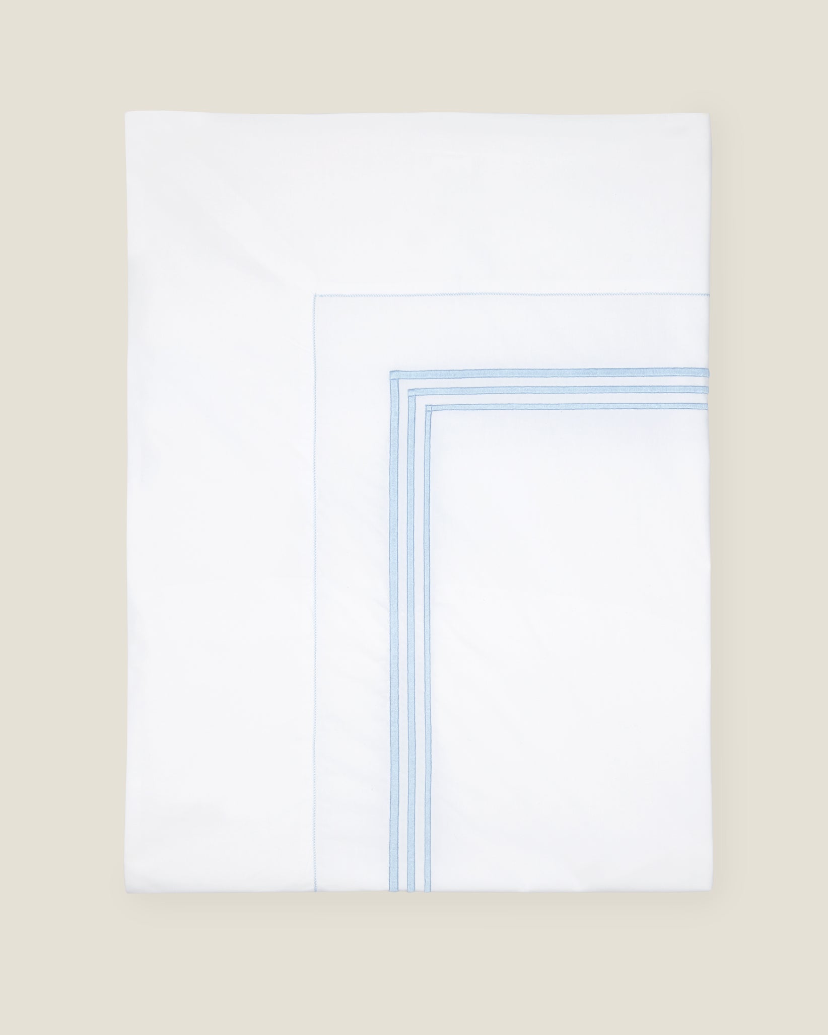 Tre Righe flat sheet white/light blue folded.