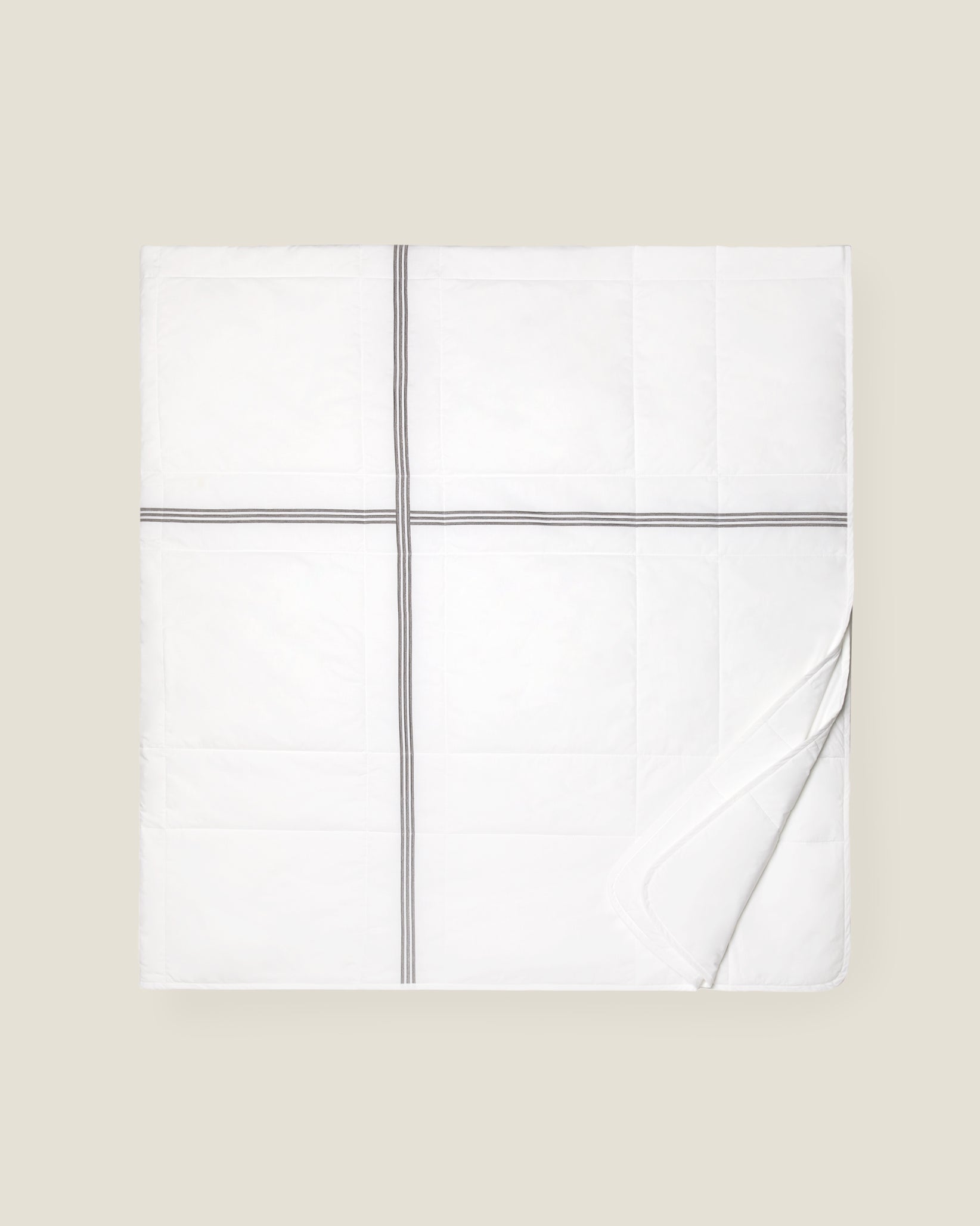 white quiltino with charcoal embroidery