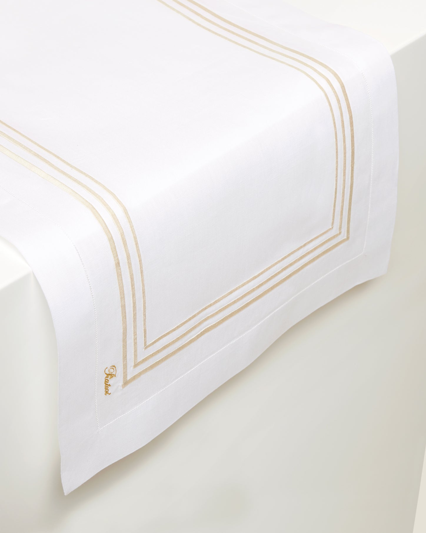 white linen table runner with beige stripes embroidery