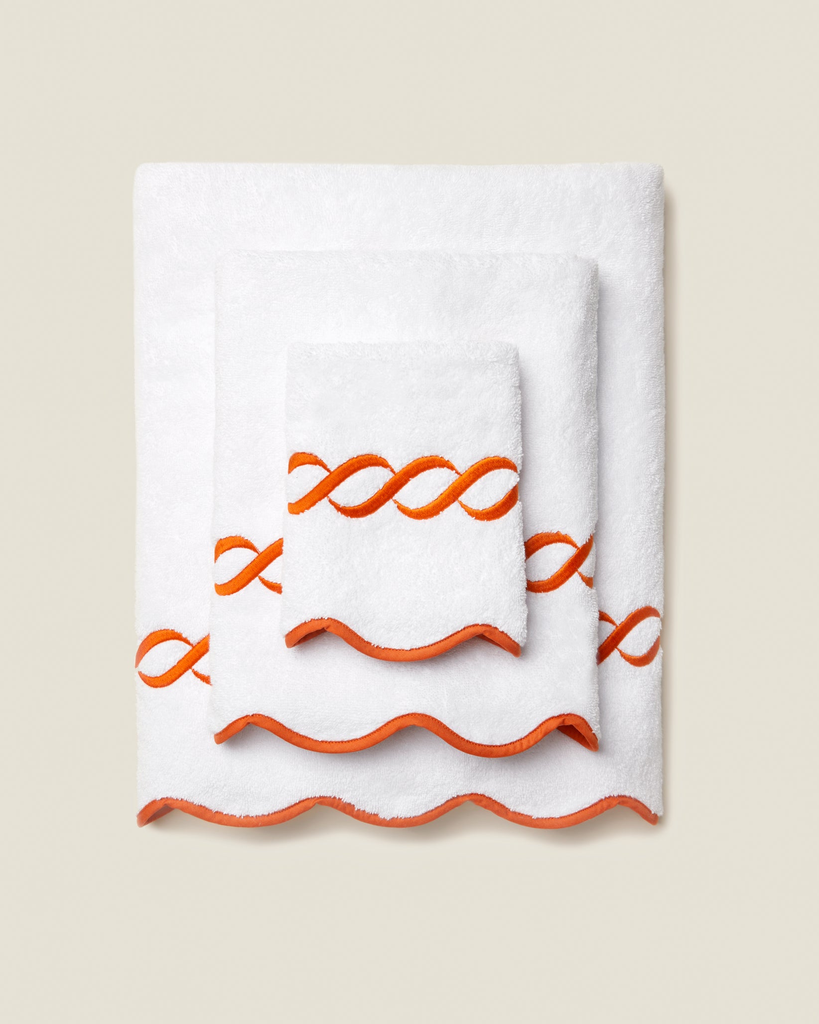 Treccia white/orange bath towel stack