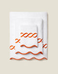 Treccia white/orange bath towel stack