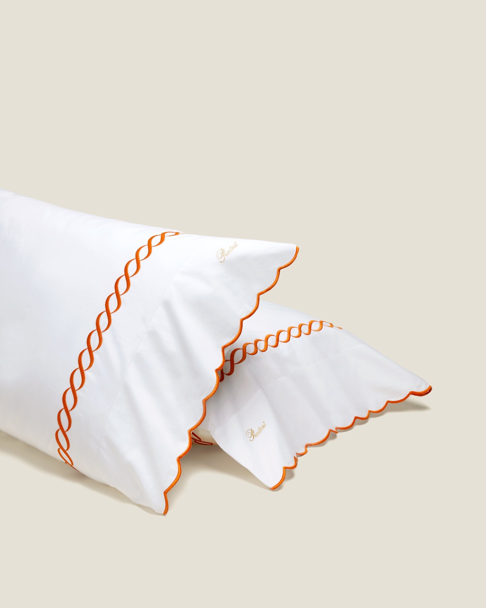Treccia white/orange pillowcase pair