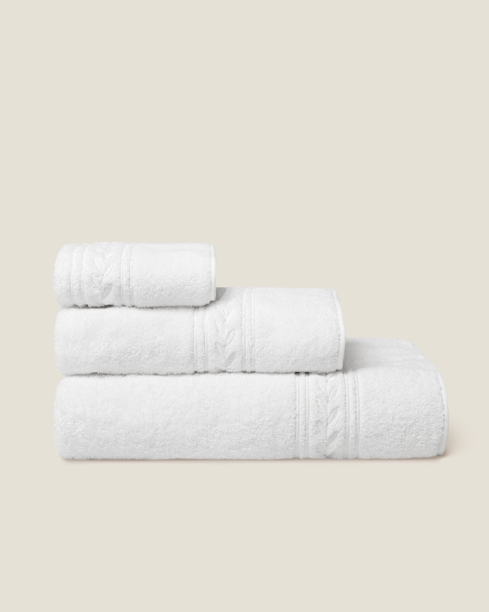 Impero Bath towel, hand towel and washcloth folded and stacked side view