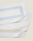 Impero Tub Mats stacked in white/medium blue, white/white, and white/beige