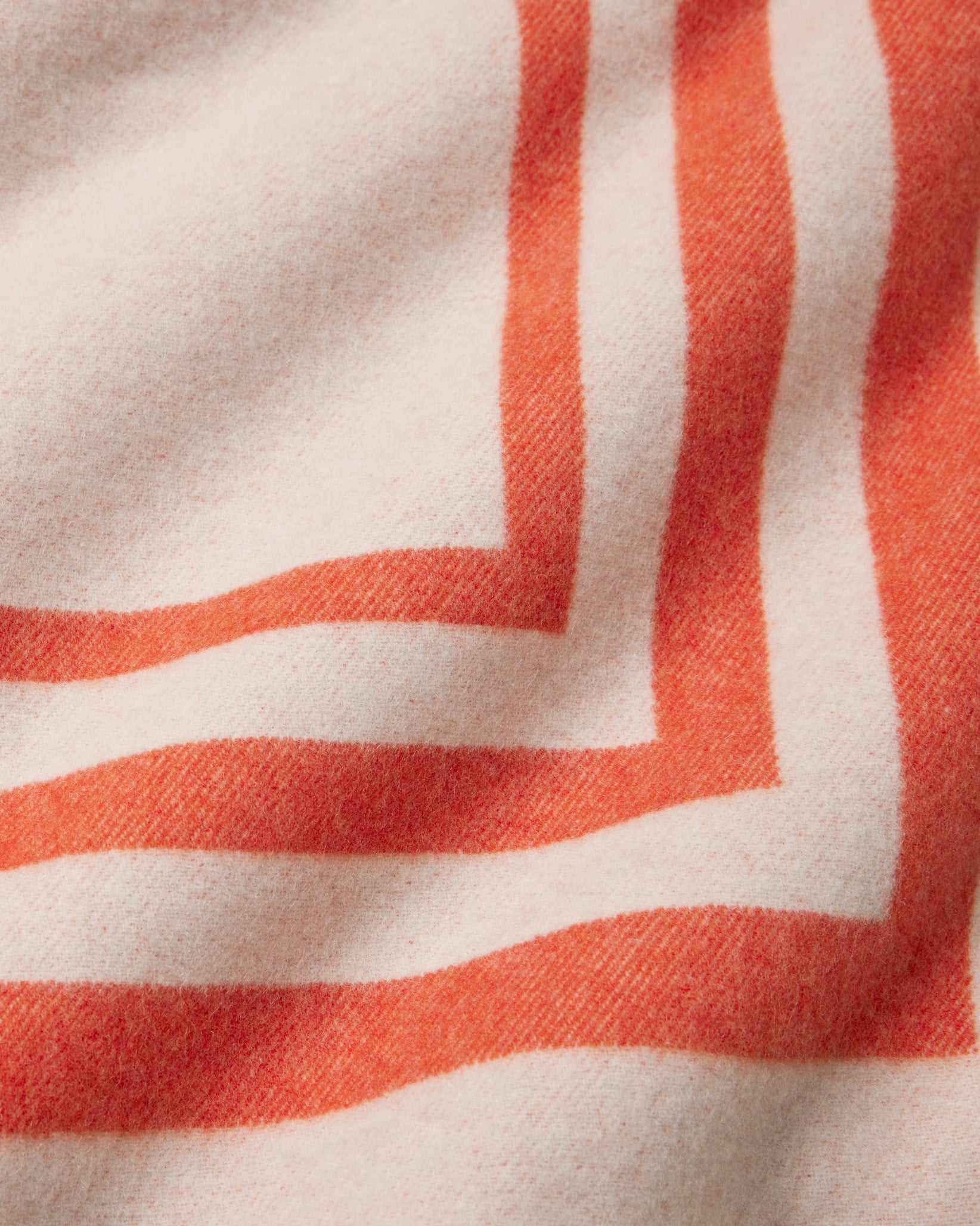 Tre Righe Throw in orange close-up