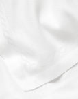 Treccia Table Runner in white close-up 