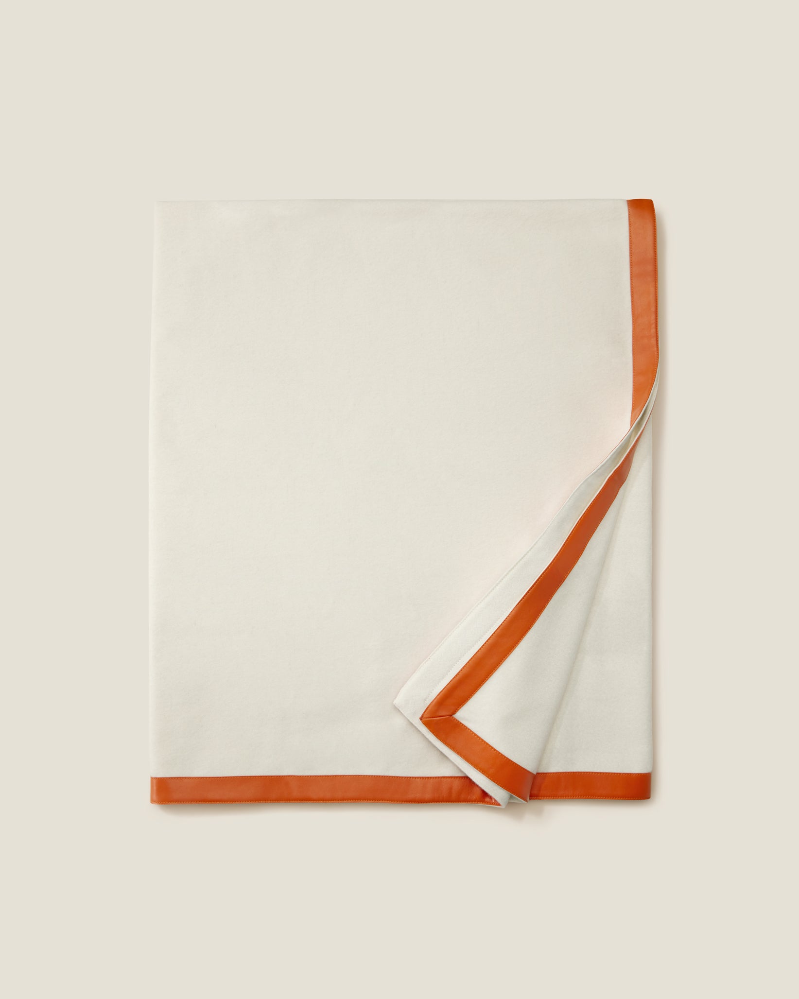 Ivory/orange dolomiti throw blanket