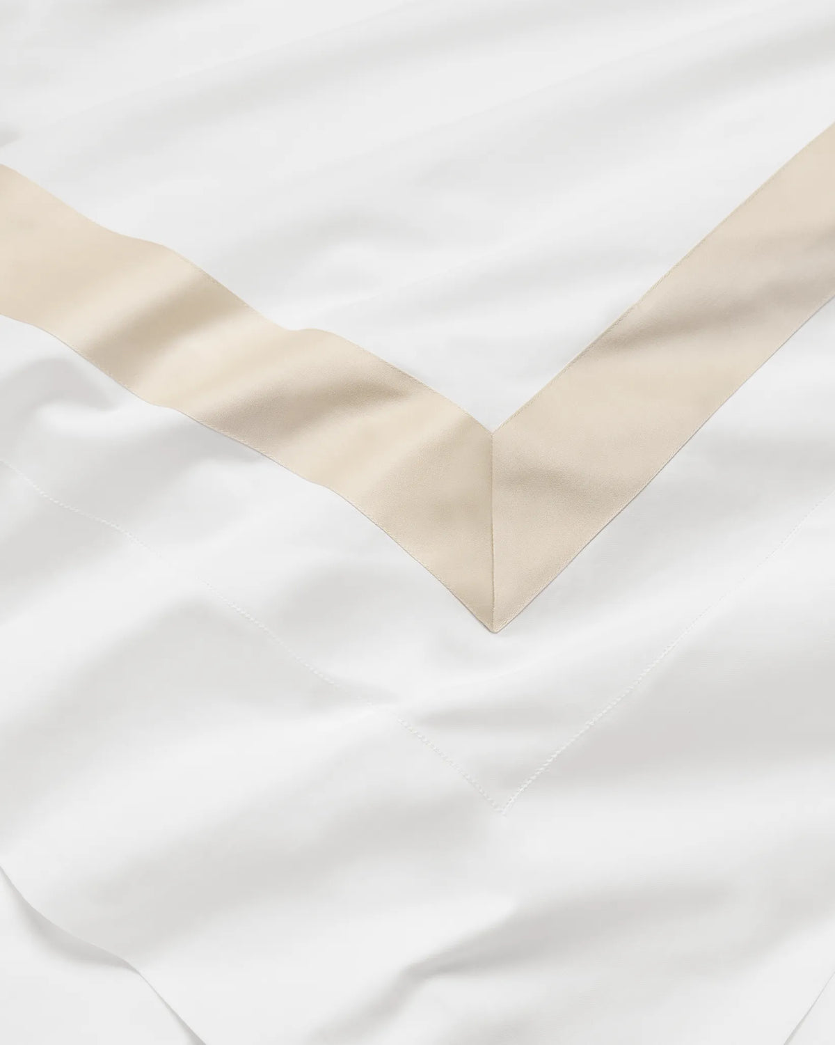 Tubo white/beige bed linens close up texture
