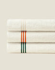 Tre Righe Ivory towels folded and stacked