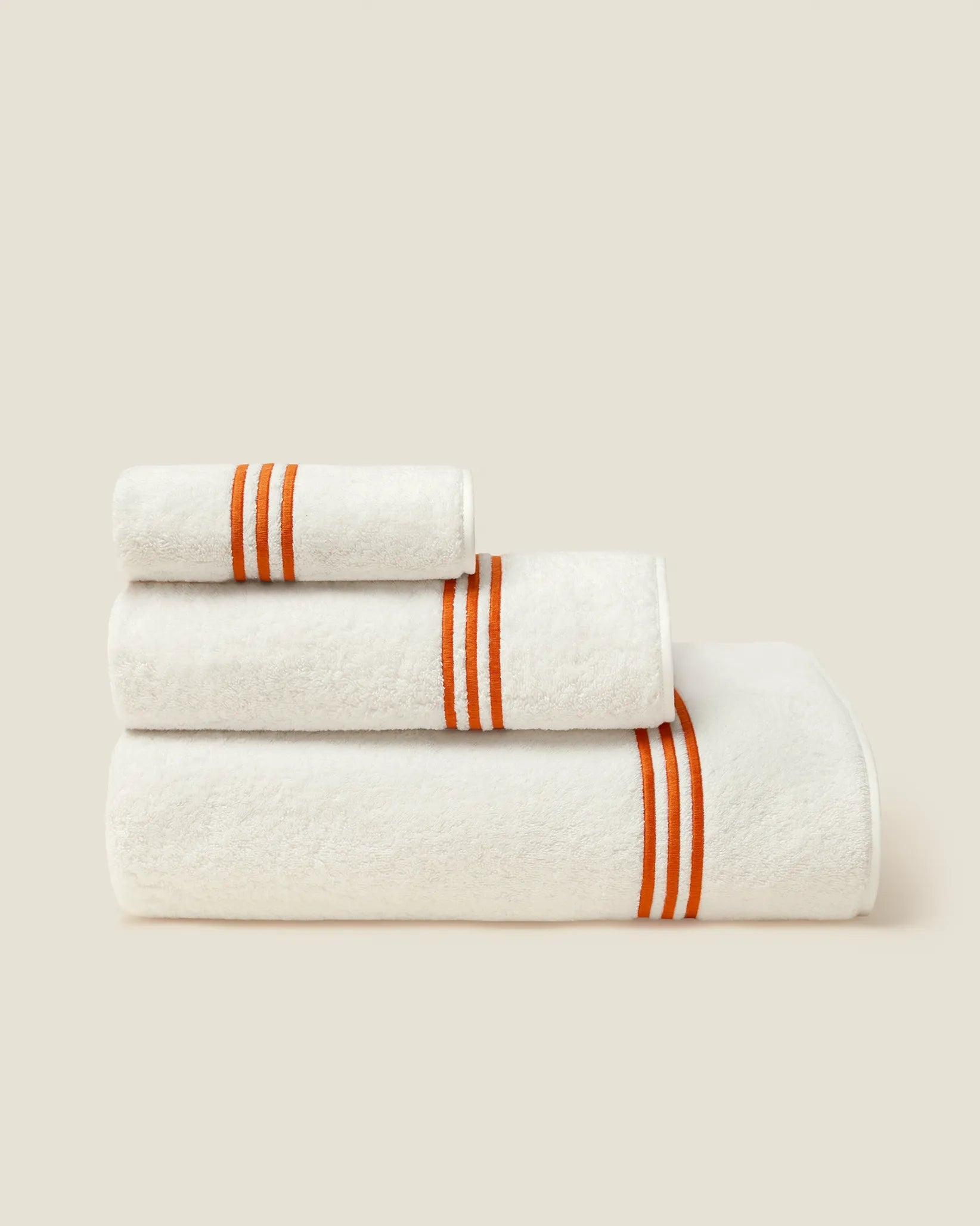 Tre Righe Ivory/orange bath towels stack side angle