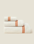 Tre Righe Ivory/orange bath towels stack side angle