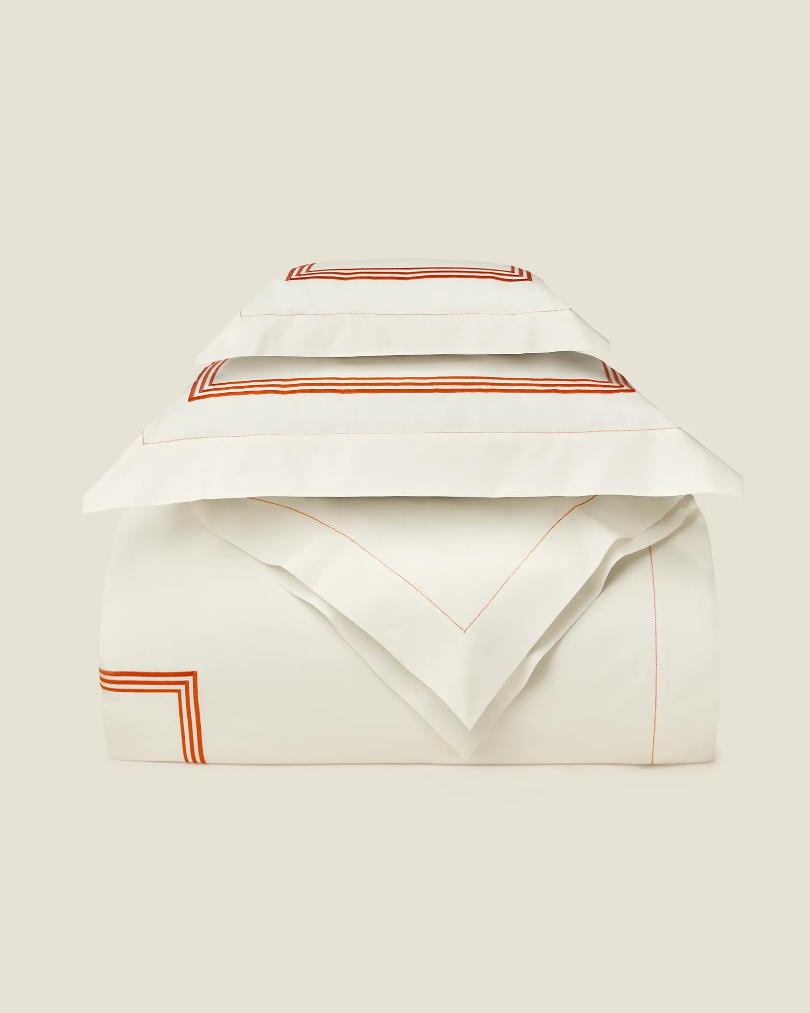 Tre Righe Ivory in Ivory/Orange Duvet cover folded.