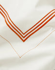 Tre Righe Ivory/orange bed linens close up