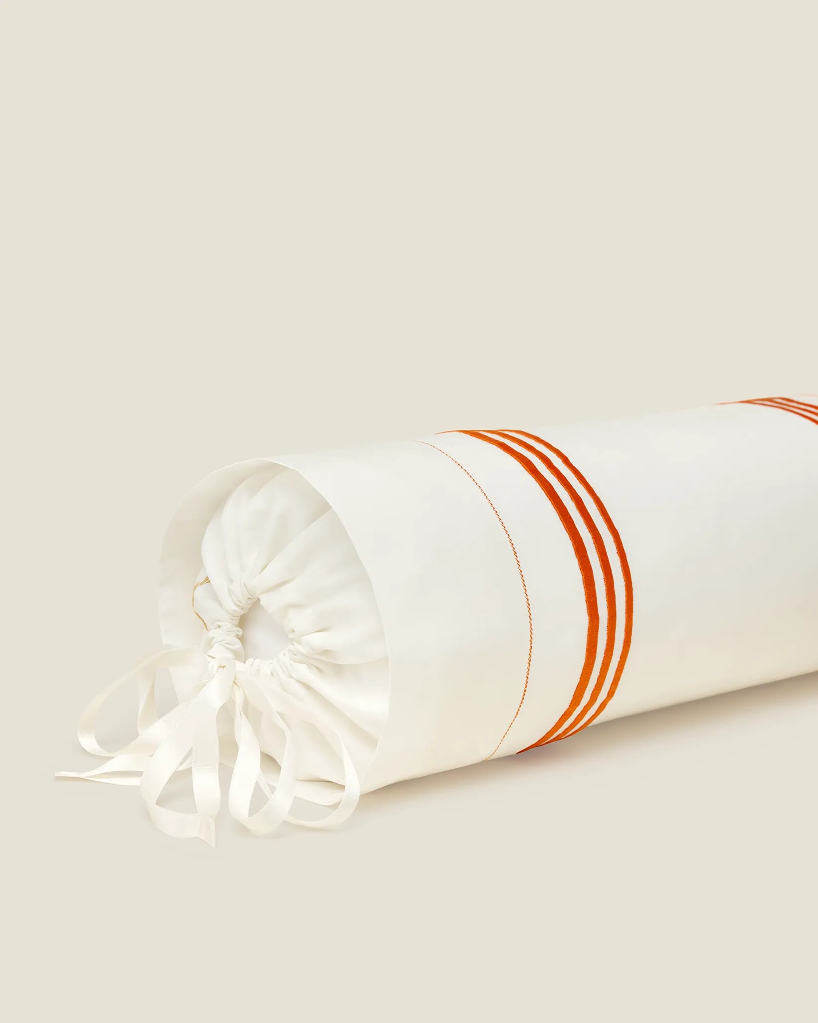 Tre Righe Ivory/orange neckroll sham corner details
