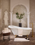 Impero ivory/beige bath linens with the bath tub.