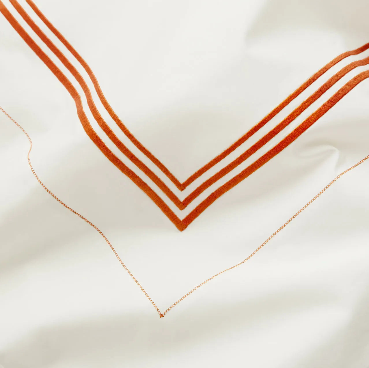 Tre Righe Ivory/orange bed linens details