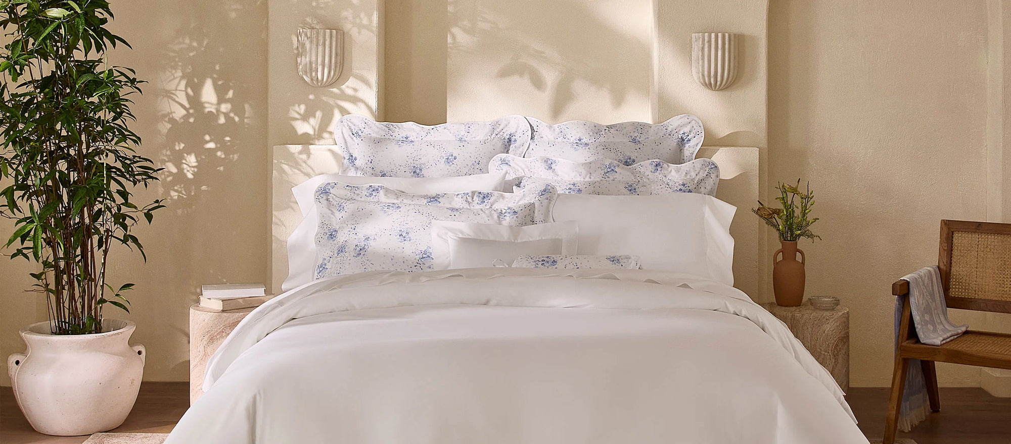 Angel Luxe white bedding with the blue M'ama Non Mama shams