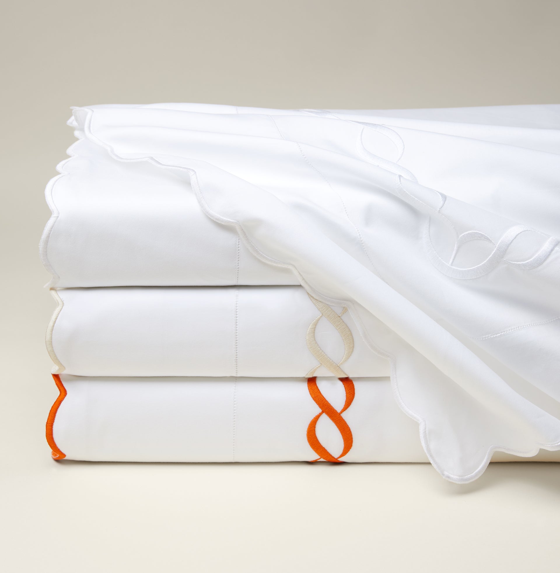 Treccia flat sheet white/white, white/beige and white/orange stack